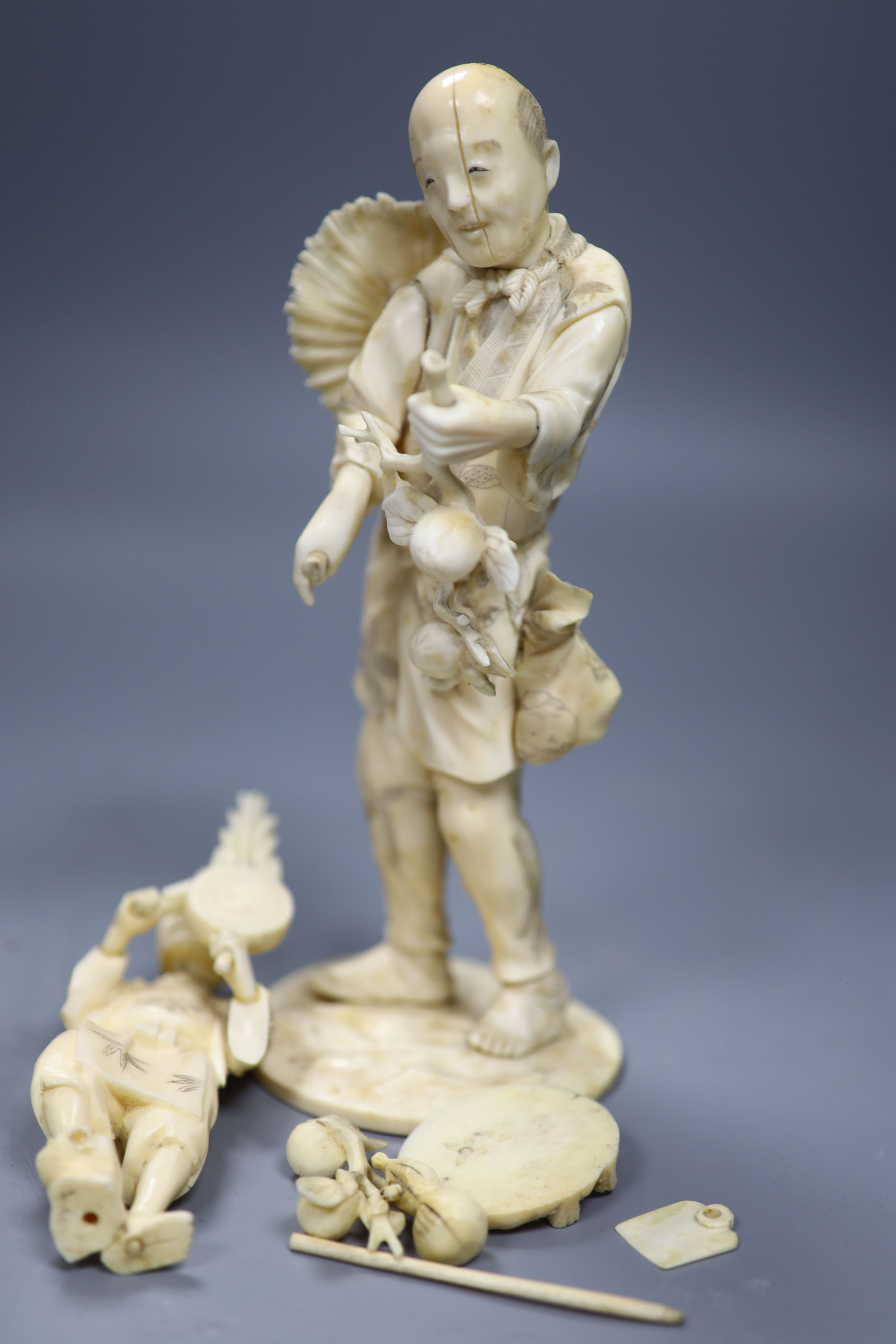 Four 19th century Japanese carved ivory figures, tallest 21cm